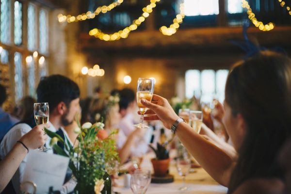 glass of champagne cheers at event 